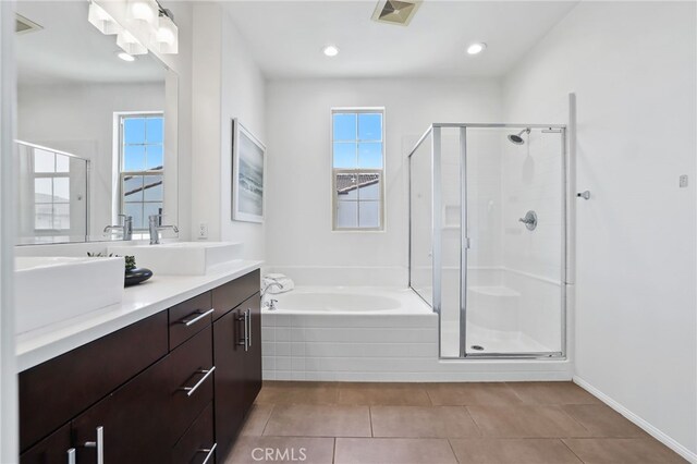 2950 19th St Unit 113, Signal Hill, CA 92707 - bathroom featuring vanity, healthy amount of natural light, a shower stall, a bath, and recessed lighting