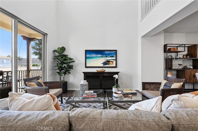 2950 19th St Unit 113, Signal Hill, CA 92707 - living area with a high ceiling and wood finished floors