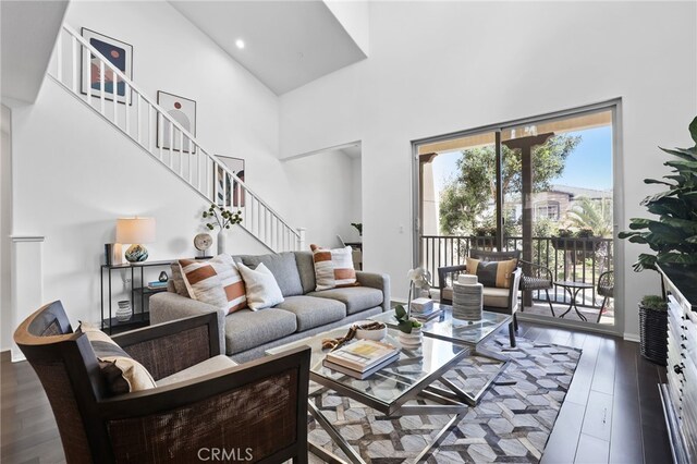 2950 19th St Unit 113, Signal Hill, CA 92707 - living room featuring a high ceiling, stairs, wood finished floors, and recessed lighting
