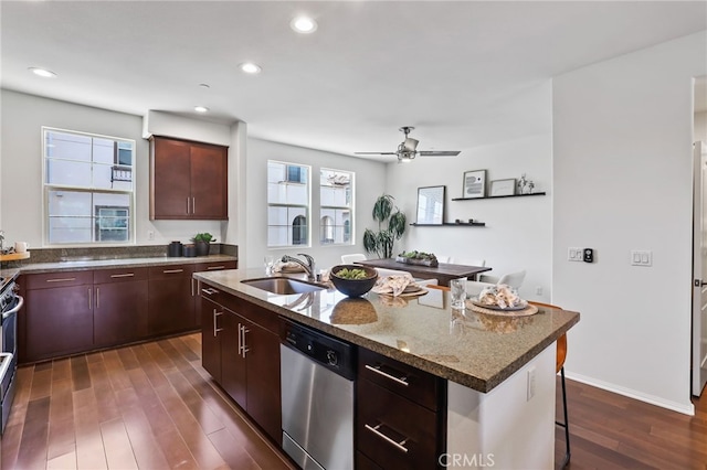 2950 19th St Unit 113, Signal Hill, CA 92707 - kitchen featuring stainless steel dishwasher, dark wood finished floors, a kitchen bar, a ceiling fan, and a center island with sink