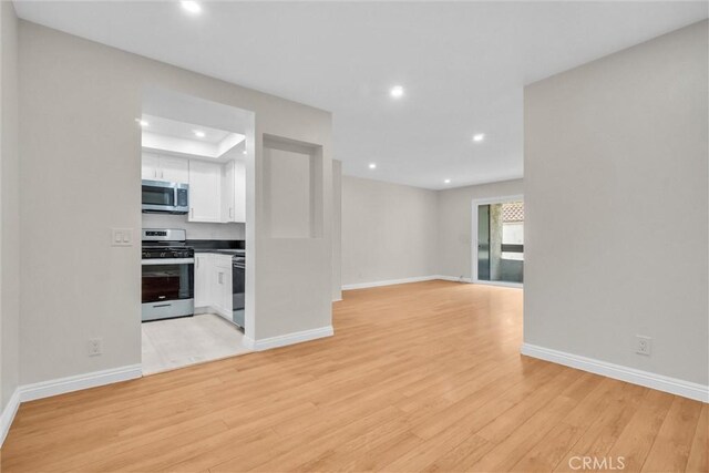 600 W 3rd St Unit C207, Santa Ana, CA 92701 - unfurnished living room featuring recessed lighting and light wood finished floors