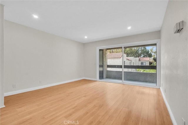 600 W 3rd St Unit C207, Santa Ana, CA 92701 - unfurnished room featuring light wood finished floors and recessed lighting