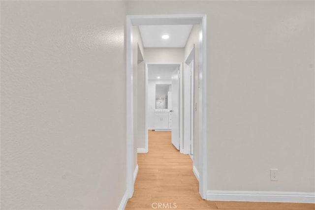 600 W 3rd St Unit C207, Santa Ana, CA 92701 - hallway with light wood-style floors and baseboards