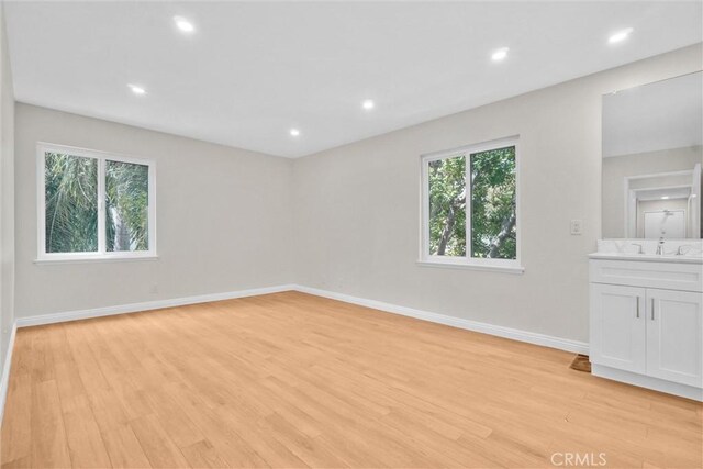 600 W 3rd St Unit C207, Santa Ana, CA 92701 - unfurnished room with light wood-type flooring and recessed lighting