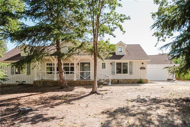 40 Bobcat Springs Rd, Buellton, CA 93427 - view of front of home with a shingled roof, board and batten siding, covered porch, and a garage