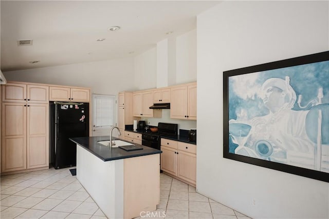 40 Bobcat Springs Rd, Buellton, CA 93427 - kitchen with black appliances, under cabinet range hood, light brown cabinetry, dark countertops, and high vaulted ceiling