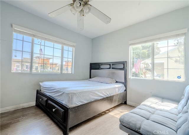 13018 Rosecrans Ave, Norwalk, CA 90650 - bedroom with wood finished floors and a ceiling fan