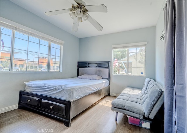 13018 Rosecrans Ave, Norwalk, CA 90650 - bedroom featuring wood finished floors and a ceiling fan