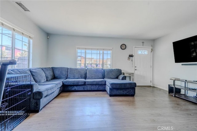 13018 Rosecrans Ave, Norwalk, CA 90650 - living area featuring wood finished floors and baseboards