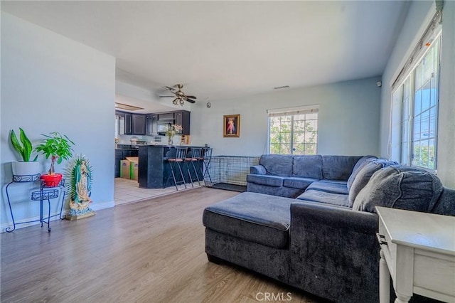 13018 Rosecrans Ave, Norwalk, CA 90650 - living area featuring light wood-type flooring and ceiling fan