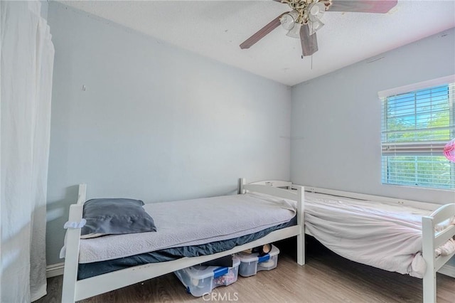 13018 Rosecrans Ave, Norwalk, CA 90650 - bedroom featuring wood finished floors and ceiling fan