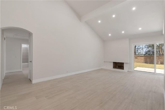 22 Sage Cyn, Pomona, CA 91766 - unfurnished living room with arched walkways, beam ceiling, light wood finished floors, recessed lighting, and high vaulted ceiling