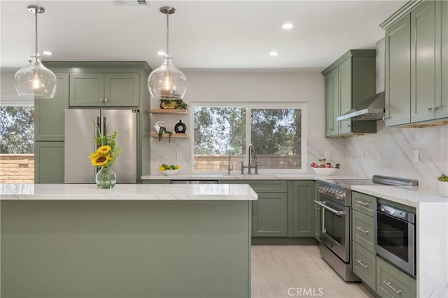 22 Sage Cyn, Pomona, CA 91766 - kitchen featuring green cabinetry, stainless steel appliances, tasteful backsplash, and recessed lighting