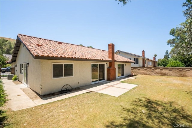 22 Sage Cyn, Pomona, CA 91766 - rear view of house with stucco siding, a tiled roof, a fenced backyard, and a patio area