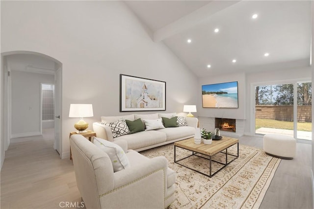 22 Sage Cyn, Pomona, CA 91766 - living room with arched walkways, beamed ceiling, recessed lighting, high vaulted ceiling, and light wood-style flooring