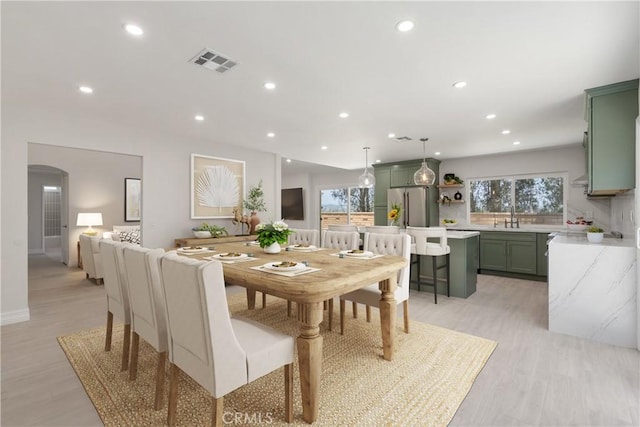 22 Sage Cyn, Pomona, CA 91766 - dining space with recessed lighting, light wood finished floors, and arched walkways