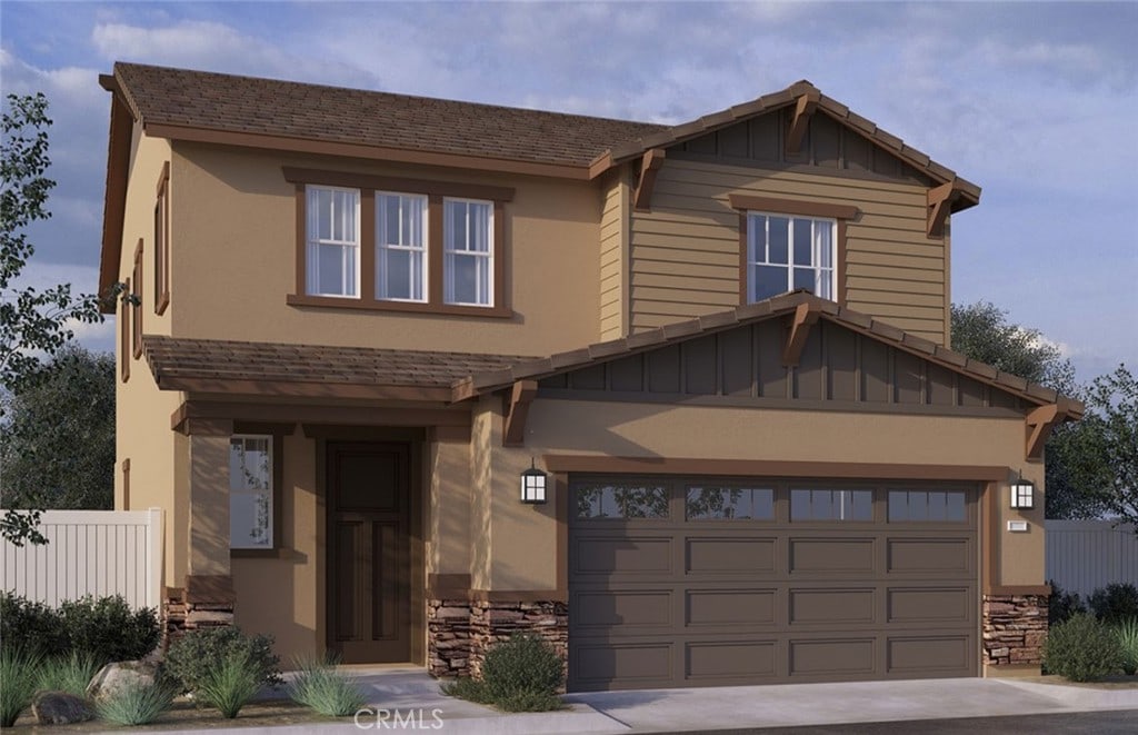 15574 Asana Way, Fontana, CA 92336 - craftsman-style house featuring an attached garage, concrete driveway, board and batten siding, and stone siding