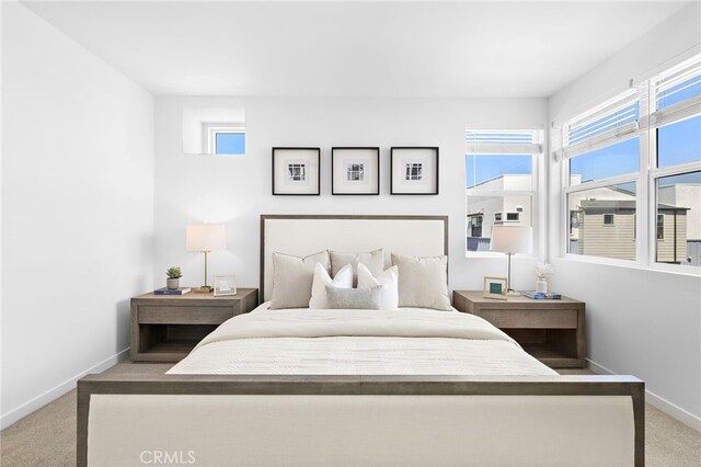 944 N Divino Privado Unit 57, Ontario, CA 91764 - carpeted bedroom with baseboards