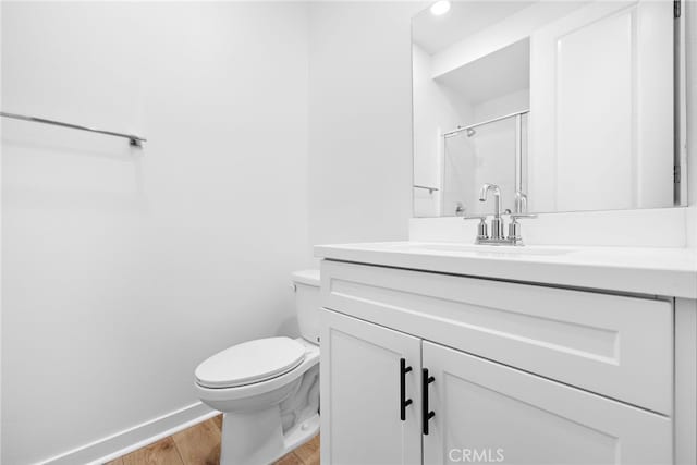 944 N Divino Privado Unit 57, Ontario, CA 91764 - bathroom featuring wood finished floors, vanity, and a shower