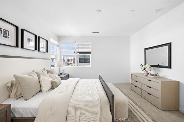 944 N Divino Privado Unit 57, Ontario, CA 91764 - bedroom with light carpet and baseboards