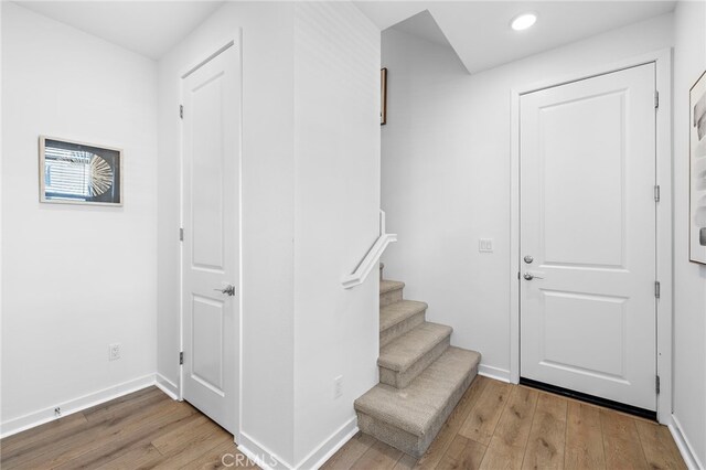 944 N Divino Privado Unit 57, Ontario, CA 91764 - foyer entrance with wood finished floors, recessed lighting, and stairway