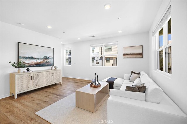 944 N Divino Privado Unit 57, Ontario, CA 91764 - living room with light wood-style floors and recessed lighting