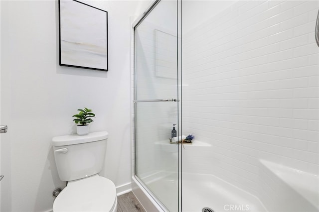 944 N Divino Privado Unit 57, Ontario, CA 91764 - bathroom featuring a stall shower and wood finished floors