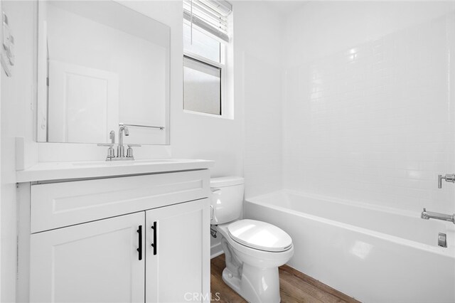 944 N Divino Privado Unit 57, Ontario, CA 91764 - full bath with wood finished floors, vanity, and washtub / shower combination