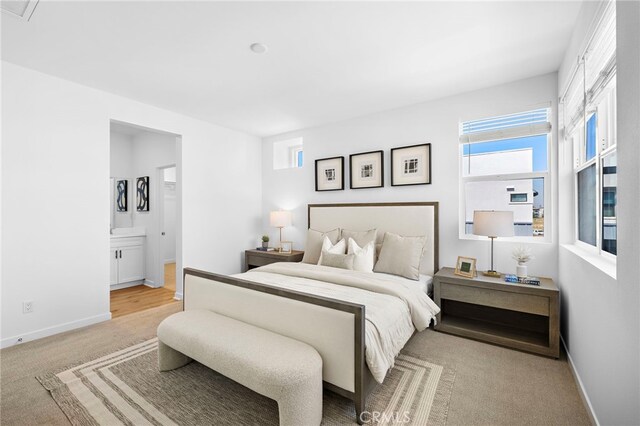 944 N Divino Privado Unit 57, Ontario, CA 91764 - bedroom featuring carpet floors and ensuite bath