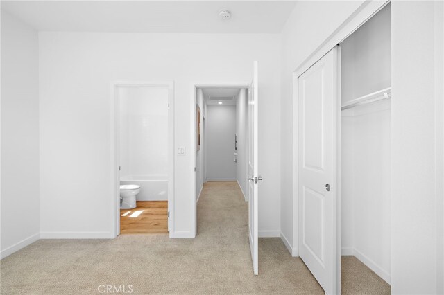 944 N Divino Privado Unit 57, Ontario, CA 91764 - unfurnished bedroom with a closet and light carpet