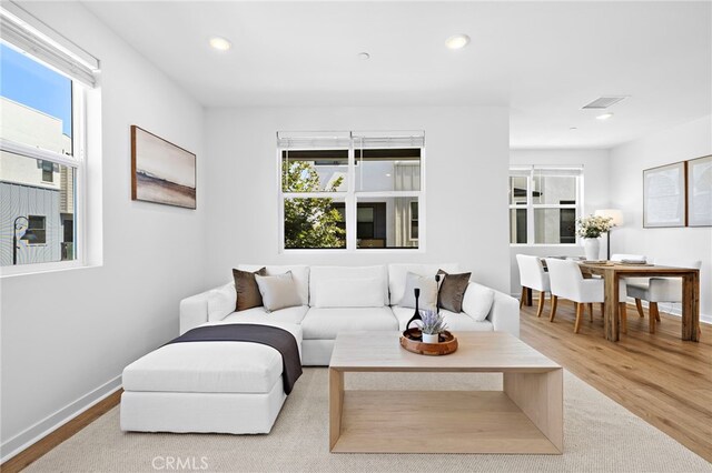 944 N Divino Privado Unit 57, Ontario, CA 91764 - living area with wood finished floors and recessed lighting