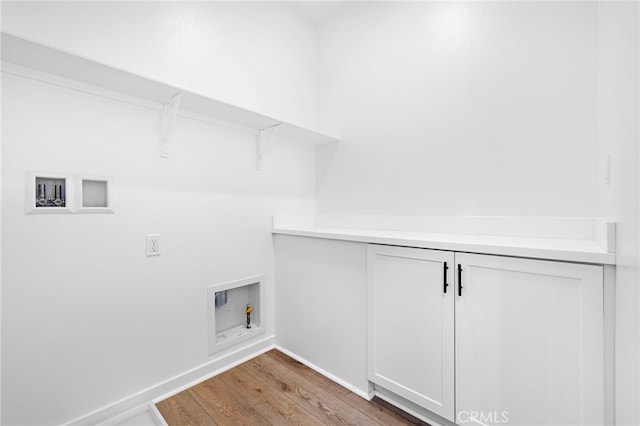 944 N Divino Privado Unit 57, Ontario, CA 91764 - laundry area featuring light wood-style floors and washer hookup