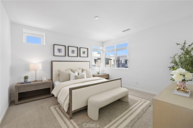 944 N Divino Privado Unit 57, Ontario, CA 91764 - bedroom with light carpet and multiple windows