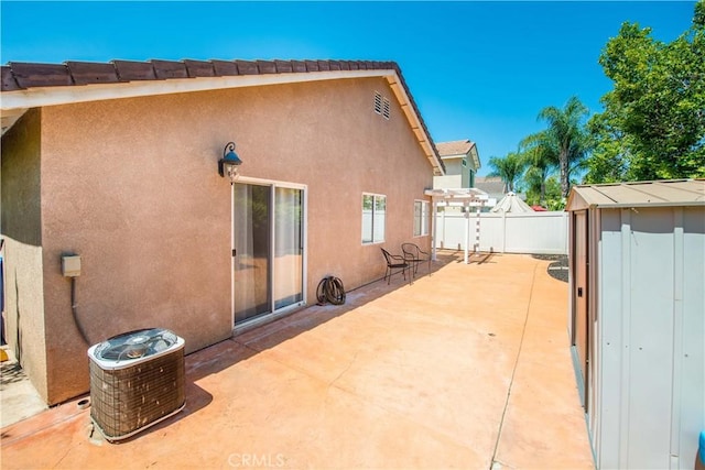 783 Pointe Vista Ln, Corona, CA 92881 - rear view of house with a patio, stucco siding, and a storage shed