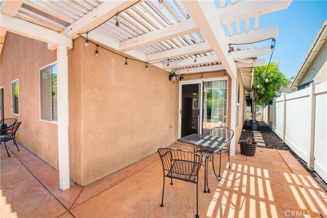 783 Pointe Vista Ln, Corona, CA 92881 - view of patio / terrace with a pergola and outdoor dining area