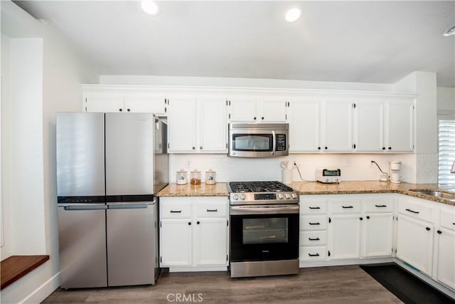 783 Pointe Vista Ln, Corona, CA 92881 - kitchen featuring stainless steel appliances, light stone counters, white cabinets, and recessed lighting