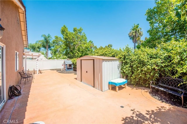 783 Pointe Vista Ln, Corona, CA 92881 - fenced backyard with a storage unit and a patio area