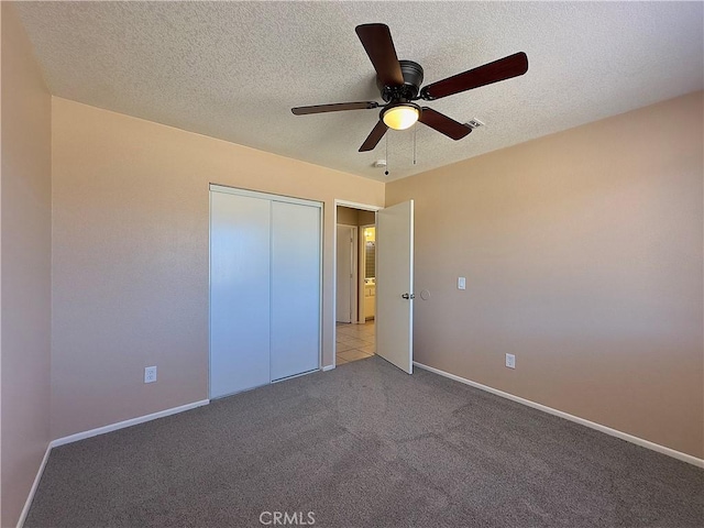 22241 Cholena Rd, Apple Valley, CA 92307 - unfurnished bedroom featuring carpet flooring, a closet, a ceiling fan, and a textured ceiling