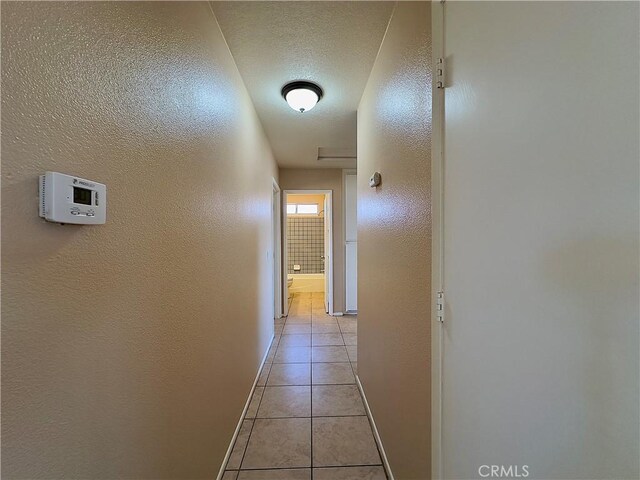 22241 Cholena Rd, Apple Valley, CA 92307 - hall with light tile patterned floors and a textured wall