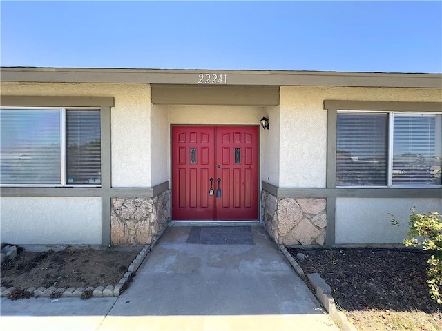22241 Cholena Rd, Apple Valley, CA 92307 - doorway to property with stone siding and stucco siding