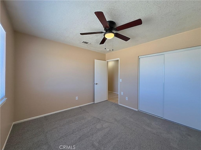 22241 Cholena Rd, Apple Valley, CA 92307 - unfurnished bedroom with carpet floors, ceiling fan, a closet, and a textured ceiling