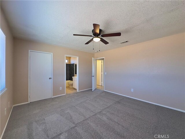 22241 Cholena Rd, Apple Valley, CA 92307 - unfurnished bedroom with a textured ceiling, light colored carpet, connected bathroom, and ceiling fan