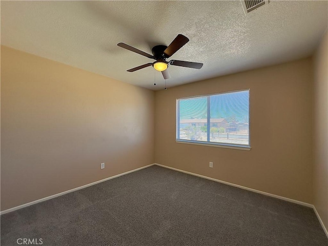 22241 Cholena Rd, Apple Valley, CA 92307 - unfurnished room with ceiling fan, dark carpet, and a textured ceiling