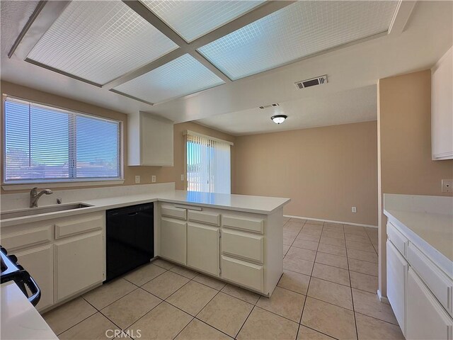 22241 Cholena Rd, Apple Valley, CA 92307 - kitchen with dishwasher, light tile patterned flooring, light countertops, and a peninsula