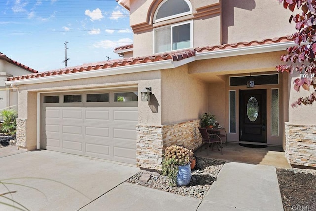 9481 Deanly St, Lakeside, CA 92040 - entrance to property with stone siding, concrete driveway, stucco siding, and a tiled roof