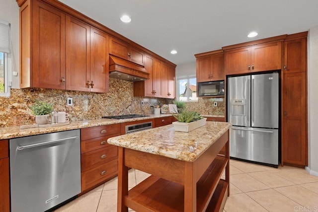 9481 Deanly St, Lakeside, CA 92040 - kitchen featuring appliances with stainless steel finishes, custom exhaust hood, light tile patterned floors, brown cabinets, and recessed lighting