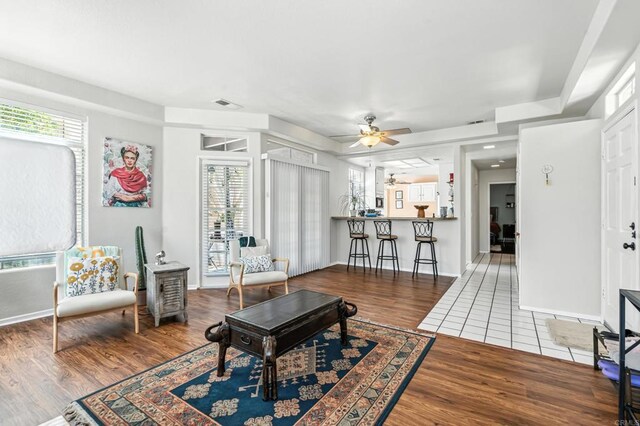 3428 Cameo Dr # 49, Oceanside, CA 92056 - living area with wood finished floors, ceiling fan, and plenty of natural light