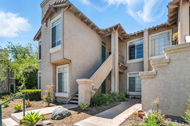 3428 Cameo Dr # 49, Oceanside, CA 92056 - view of side of property with stucco siding and stairs