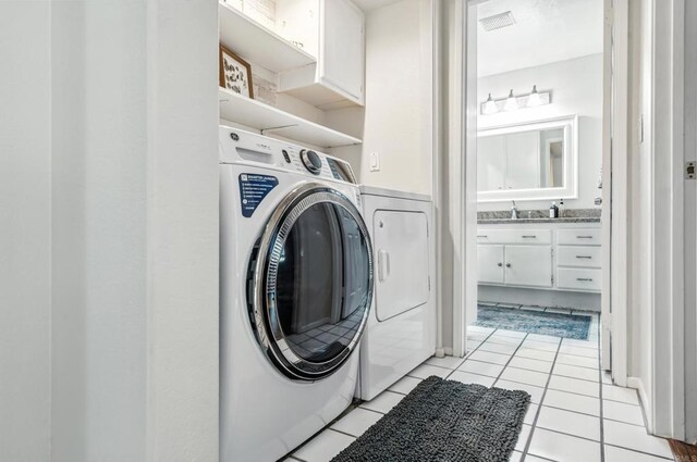 3428 Cameo Dr # 49, Oceanside, CA 92056 - laundry room featuring light tile patterned flooring and a sink
