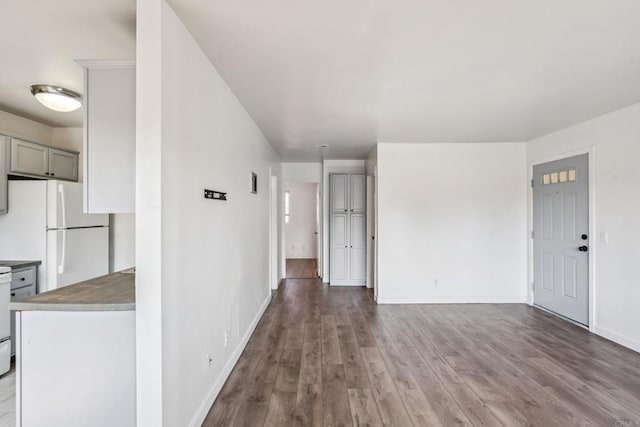 4402 Delta St Unit 23, San Diego, CA 92113 - unfurnished living room featuring wood finished floors and baseboards